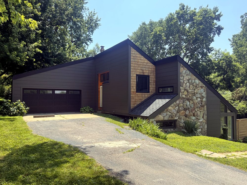 Dark modern home with cedar shake and stone in the Omaha metro